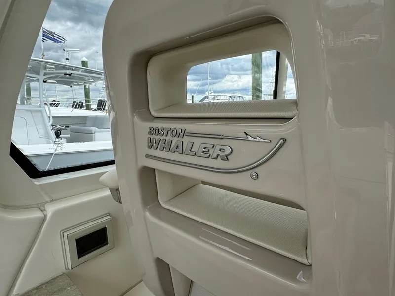 Slide: The Image of 2020 Boston Whaler 380 Realm interior detail with logo. - 23