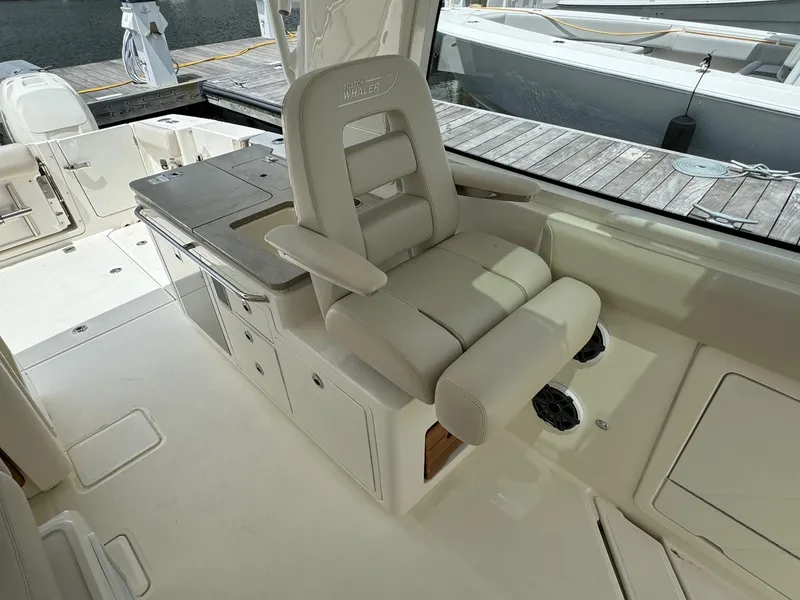 Slide: The Image of Luxurious captain's chair on 2020 Boston Whaler 380 Realm boat. - 29