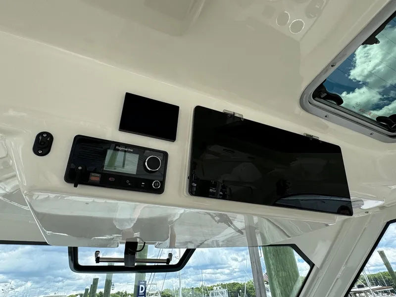 Slide: The Image of Control panel of a 2020 Boston Whaler 380 Realm boat with navigation equipment. - 30