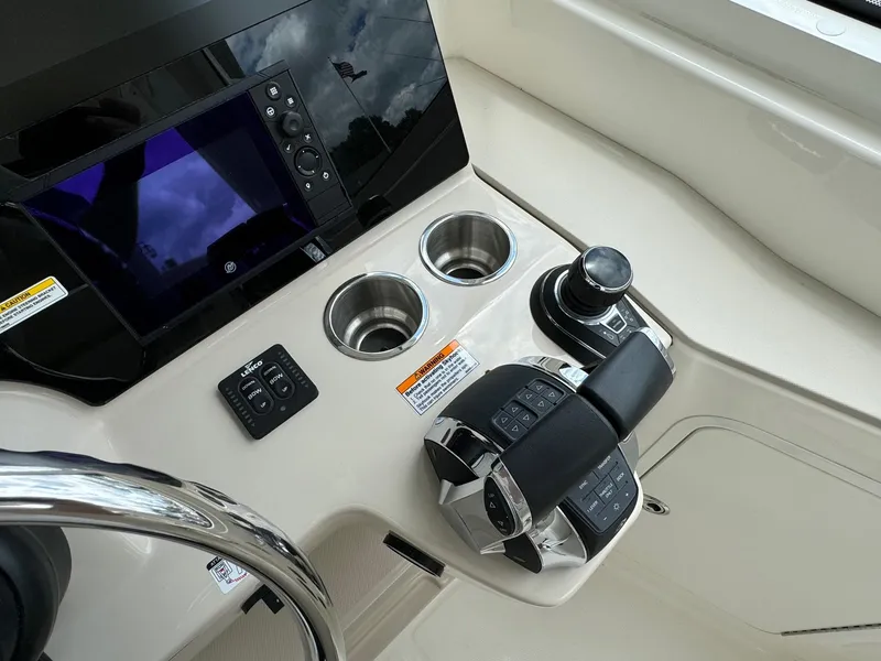 Slide: The Image of Boston Whaler 380 Realm 2020 helm with controls and display screen. - 31
