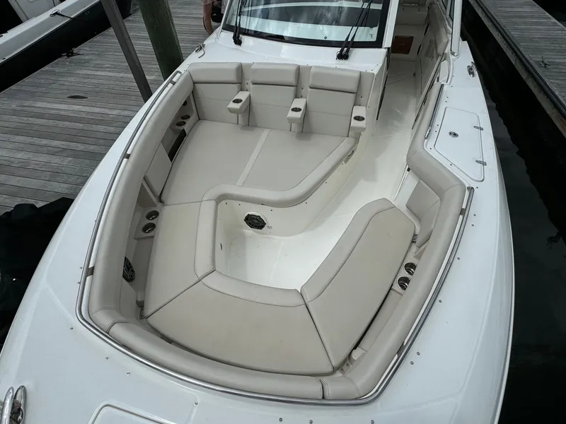 Slide: The Image of 2020 Boston Whaler 380 Realm boat with spacious seating area docked at marina. - 32