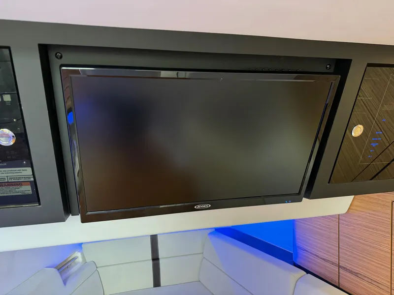 Slide: The Image of Flat-screen TV in the cabin of a 2020 Boston Whaler 380 Realm boat. - 38