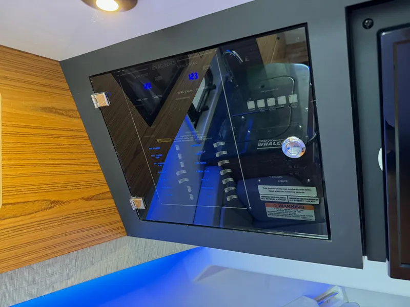 Slide: The Image of Control panel of a 2020 Boston Whaler 380 Realm boat. - 39