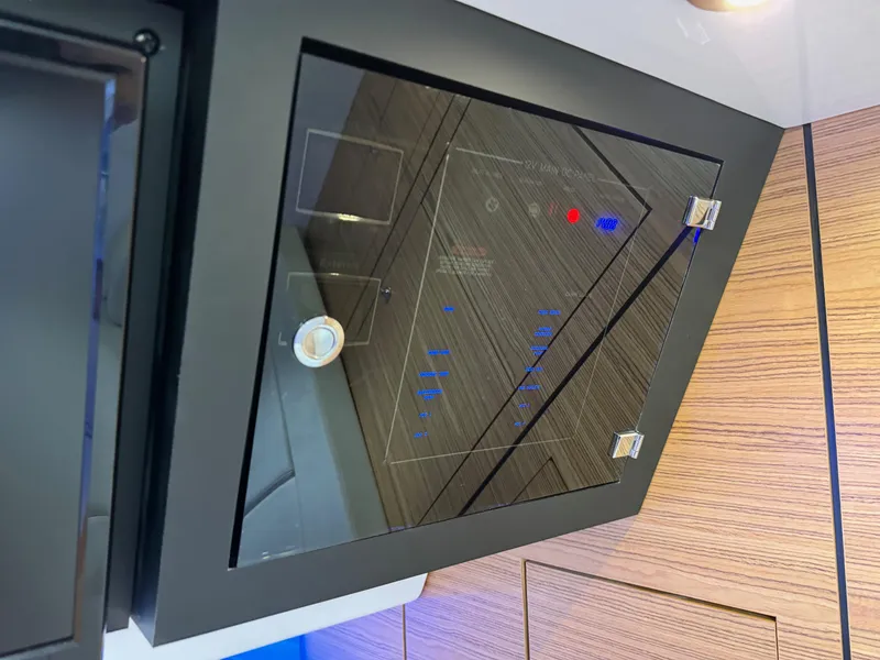 Slide: The Image of Control panel on a 2020 Boston Whaler 380 Realm boat. - 40