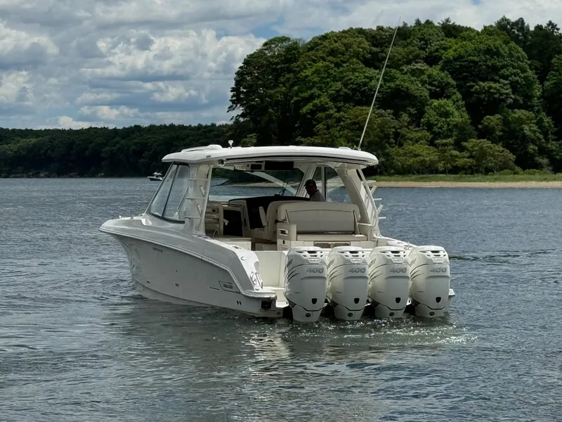 Slide: The Image of 2020 Boston Whaler 380 Realm boat with quad engines on a lake. - 6