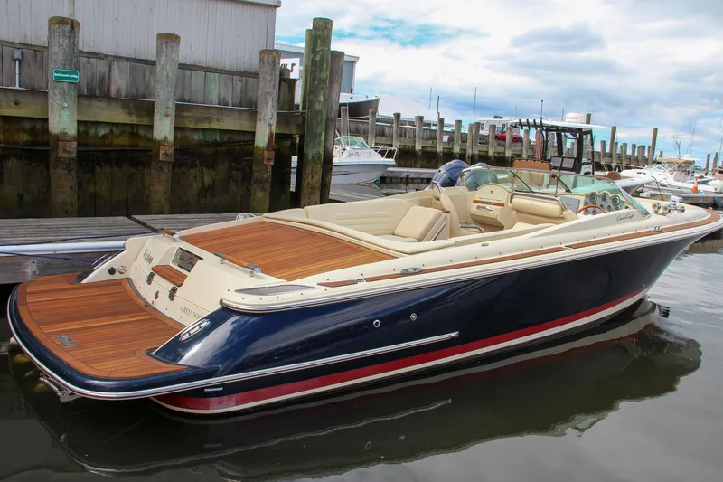 Slide: The Image of 2013 Chris-Craft Launch 28 boat dashboard with Garmin navigation system at marina. - 11