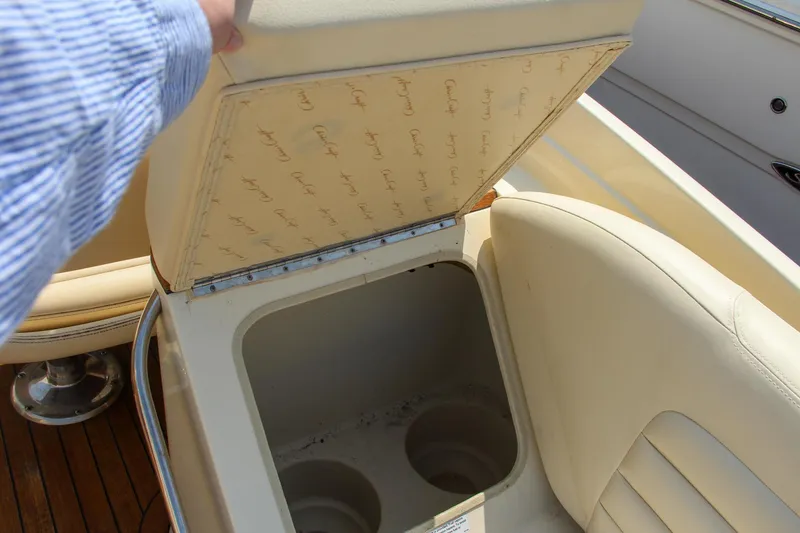 Slide: The Image of 2013 Chris-Craft Launch 28 boat docked, showcasing luxurious interior and sleek design. - 12