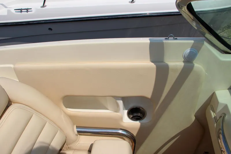 Slide: The Image of 2013 Chris-Craft Launch 28 boat storage compartment with cup holders. - 15