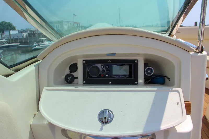 Slide: The Image of Storage compartment in 2013 Chris-Craft Launch 28 boat with cup holders. - 16