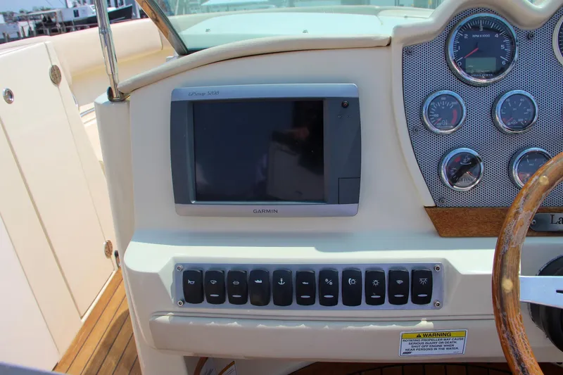 Slide: The Image of Interior detail of 2013 Chris-Craft Launch 28 boat with beige upholstery. - 22