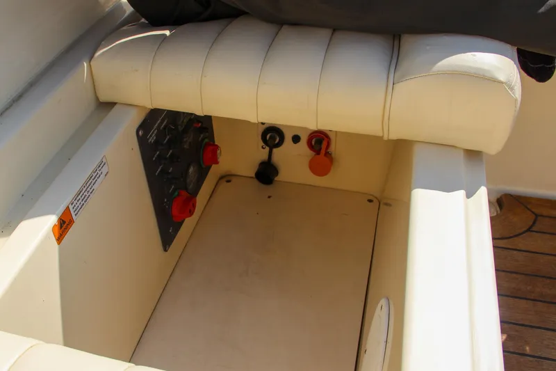 Slide: The Image of 2013 Chris-Craft Launch 28 boat docked, side view with sleek design and open cockpit. - 34