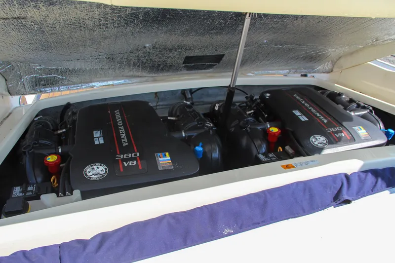 Slide: The Image of 2013 Chris-Craft Launch 28 boat control panel and seating area. - 37