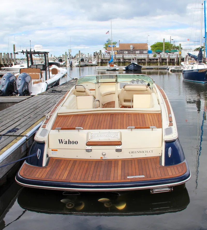Slide: The Image of Dashboard of a 2013 Chris-Craft Launch 28 boat with gauges and controls. - 41
