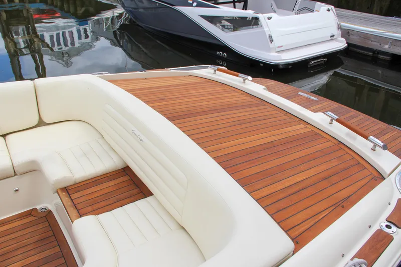 Slide: The Image of 2013 Chris-Craft Launch 28 boat docked at a marina. - 46