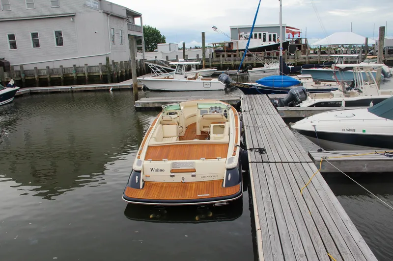 Slide: The Image of 2013 Chris-Craft Launch 28 boat with luxurious seating and wooden deck. - 54