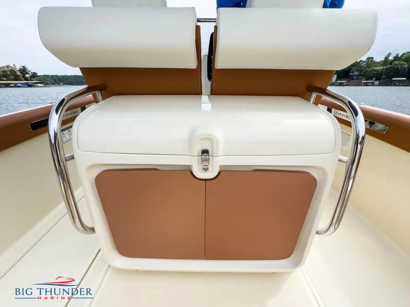 Slide: The Image of Capoforte FX240 2024 boat interior with storage compartment and Big Thunder Marine logo. - 15