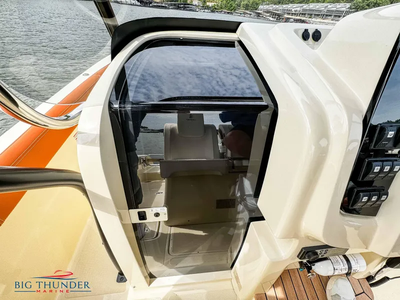 Slide: The Image of 2024 Capoforte FX240 boat interior with glass door and control panel. - 34