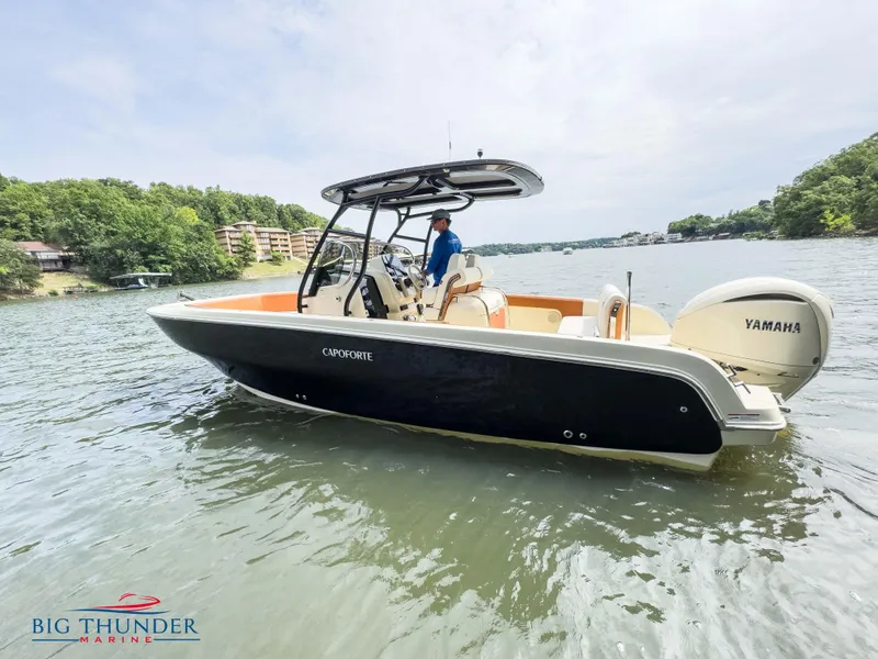 Slide: The Image of 2024 Capoforte FX240 boat on water with Yamaha engine. - 6