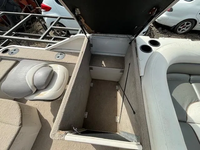 Slide: The Image of 2004 Crestliner 2485 LSI boat interior storage compartment with open lid. - 16