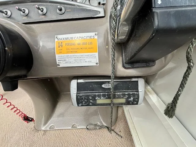 Slide: The Image of Close-up of the dashboard and capacity plate of a 2004 Crestliner 2485 LSI boat. - 22