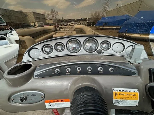Slide: The Image of Dashboard of a 2004 Crestliner 2485 LSI boat with gauges and controls. - 23
