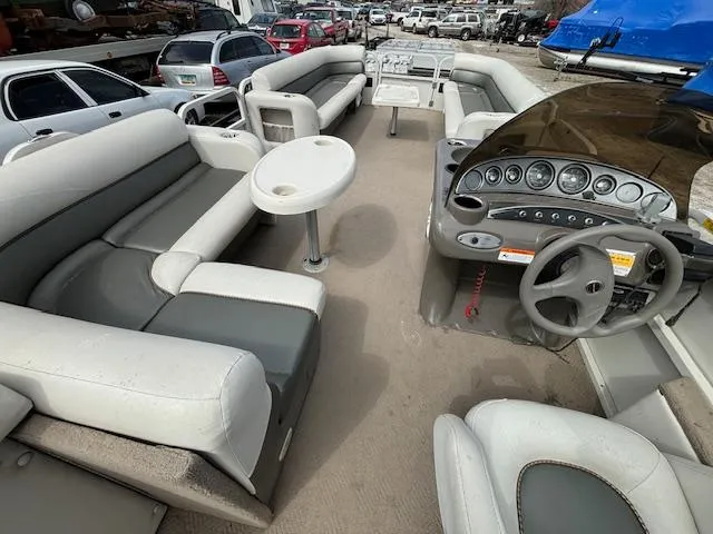 Slide: The Image of 2004 Crestliner 2485 LSI pontoon boat interior with spacious seating and control console. - 24