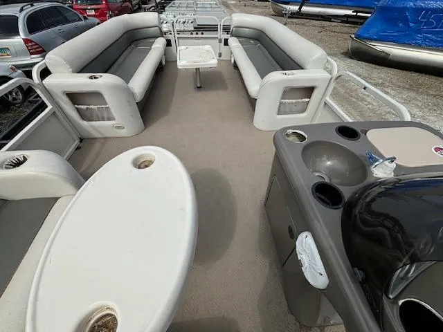 Slide: The Image of 2004 Crestliner 2485 LSI pontoon boat interior with seating and table. - 25