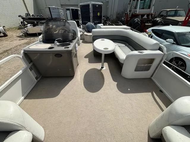 Slide: The Image of 2004 Crestliner 2485 LSI pontoon boat interior with seating and helm station. - 9