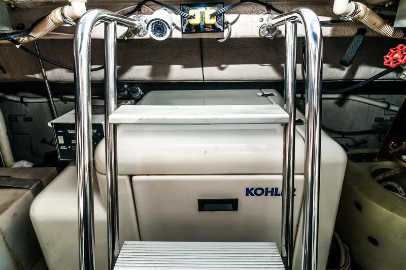 Slide: The Image of Engine room of a 1994 Sea Ray 500 Sundancer with Kohler generator. - 11