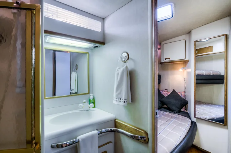 Slide: The Image of 1994 Sea Ray 500 Sundancer bathroom and bedroom interior. - 13