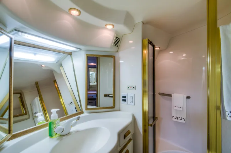 Slide: The Image of Luxurious bathroom in 1994 Sea Ray 500 Sundancer yacht with mirrors and modern fixtures. - 14