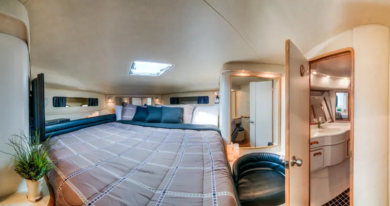 Slide: The Image of Luxurious bedroom interior of 1994 Sea Ray 500 Sundancer yacht with ensuite bathroom. - 16