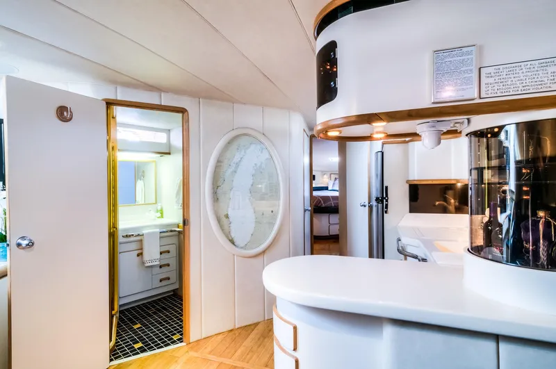 Slide: The Image of Interior of 1994 Sea Ray 500 Sundancer yacht with modern kitchen and bathroom. - 17