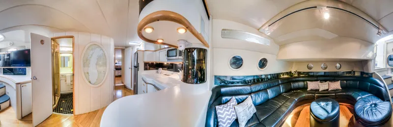 Slide: The Image of Luxurious interior of 1994 Sea Ray 500 Sundancer yacht with leather seating and modern amenities. - 18