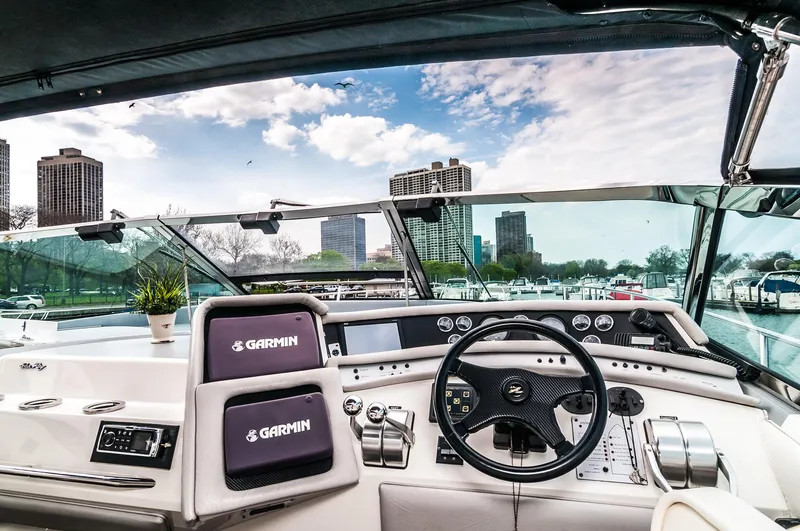 Slide: The Image of Cockpit view of a 1994 Sea Ray 500 Sundancer yacht with Garmin navigation. - 9
