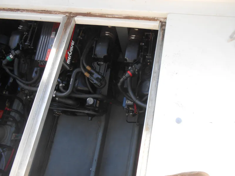 Slide: The Image of Engine compartment of a 1991 Sea Ray Sundancer 310 boat showing MerCruiser engines. - 15