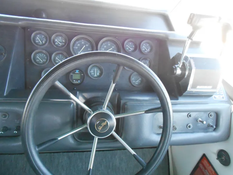 Slide: The Image of Steering wheel and dashboard of 1991 Sea Ray Sundancer 310 boat. - 6