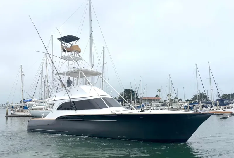 Slide: The Image of 1991 Buddy Davis Convertible yacht on calm water, clear sky background. - 0