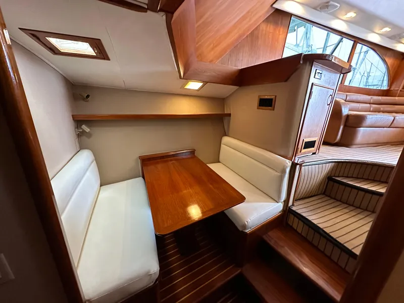 Slide: The Image of 1991 Buddy Davis Convertible yacht interior with leather seating and wooden accents. - 12