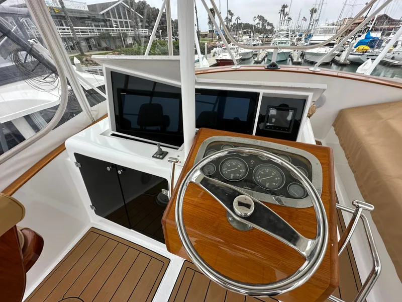 Slide: The Image of 1991 Buddy Davis Convertible interior with dining area and wooden table. - 17