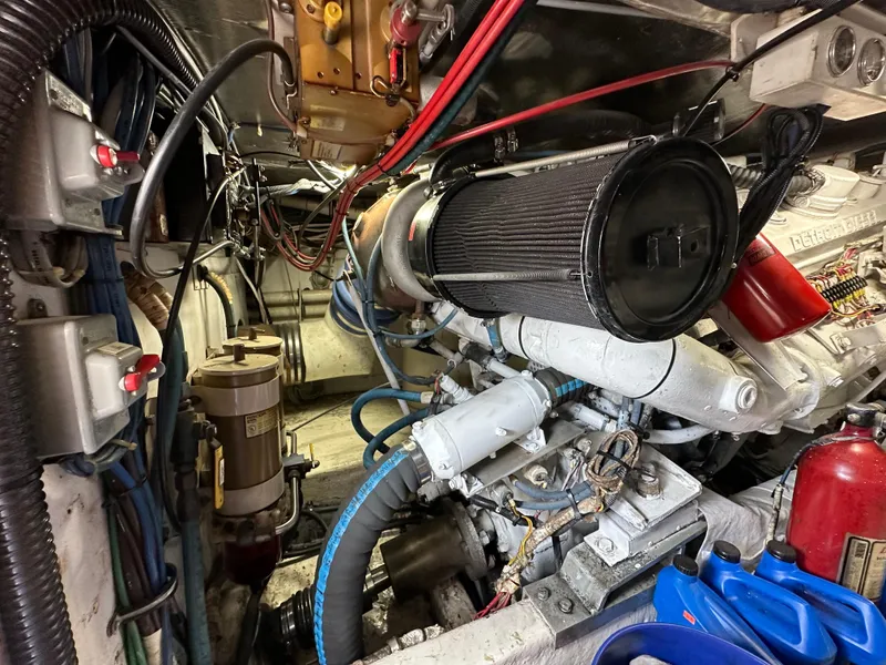 Slide: The Image of Engine room of a 1991 Buddy Davis Convertible boat with visible components and wiring. - 26