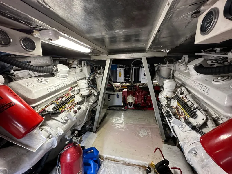 Slide: The Image of Engine room of a 1991 Buddy Davis Convertible boat with twin diesel engines. - 28