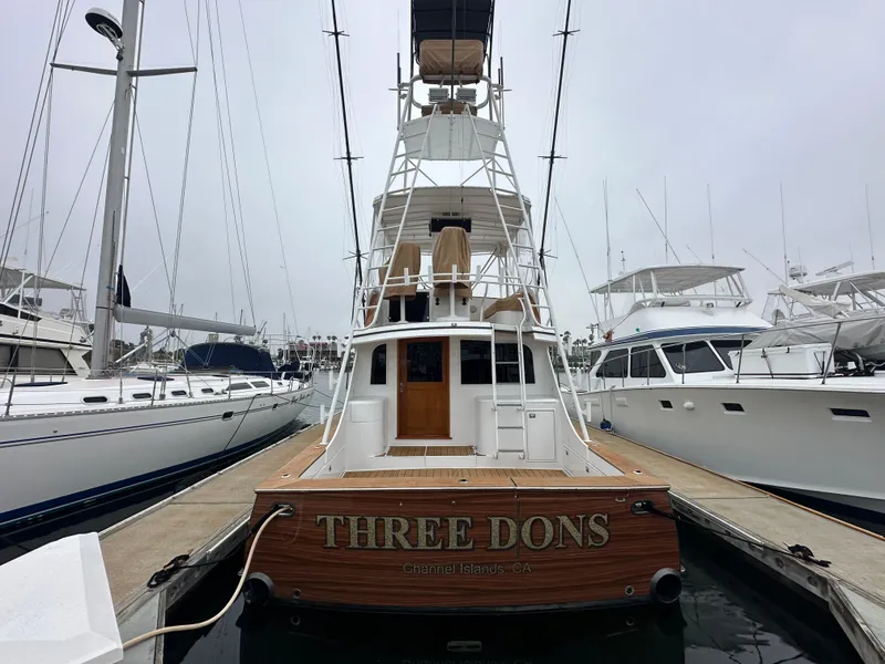 Slide: The Image of 1991 Buddy Davis Convertible yacht cruising on open sea under clear blue sky. - 4