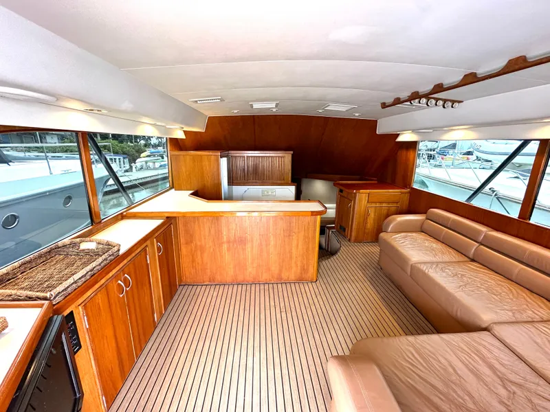 Slide: The Image of 1991 Buddy Davis Convertible yacht cruising on clear turquoise waters. - 6