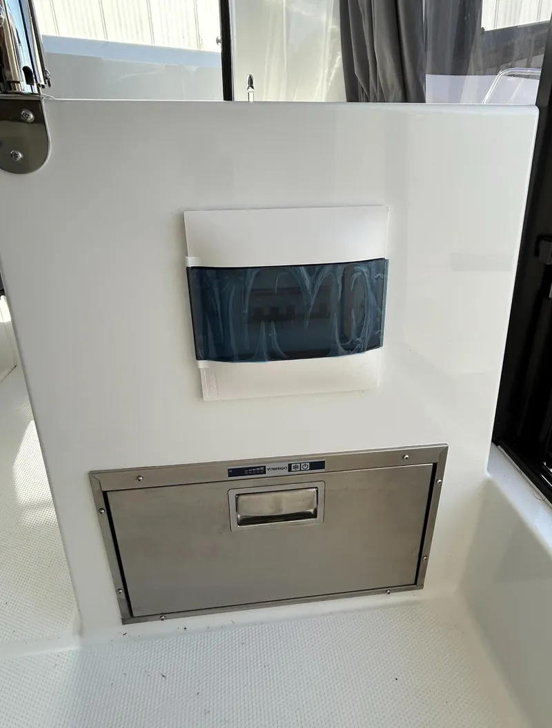 Slide: The Image of 2024 Parker Poland 800 Pilothouse interior detail with storage compartment. - 12