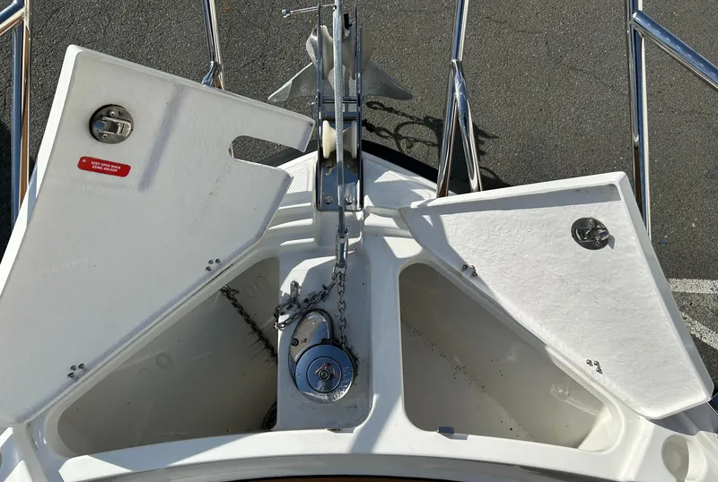 Slide: The Image of Parker Poland 800 Pilothouse 2024 anchor compartment with open hatches and chain mechanism. - 16