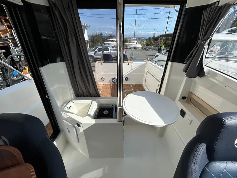 Slide: The Image of Interior of 2024 Parker Poland 800 Pilothouse boat with seating and table. - 9