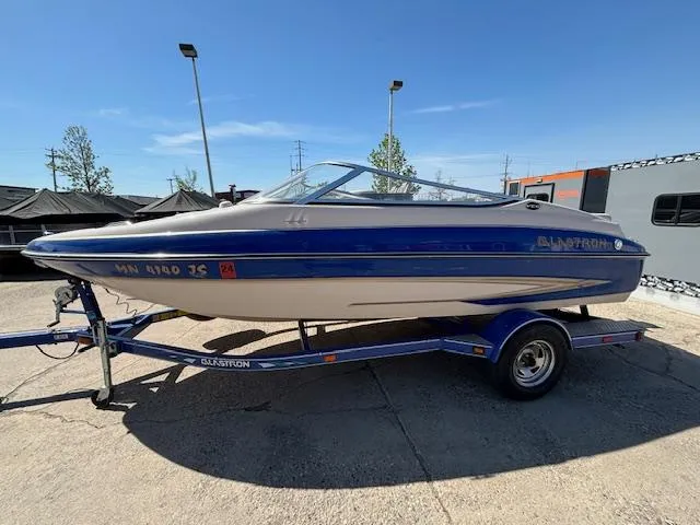 Slide: The Image of 2004 Glastron GX 185 boat on trailer in outdoor setting. - 1