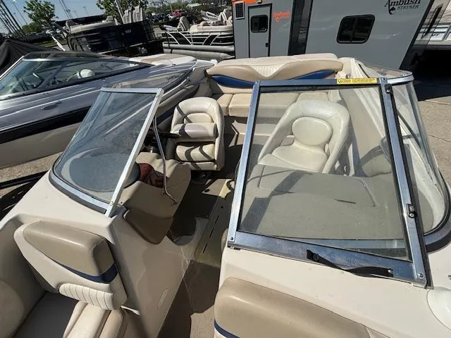 Slide: The Image of 2004 Glastron GX 185 boat interior with seating and windshield. - 21