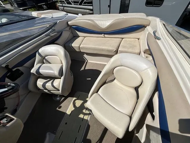 Slide: The Image of 2004 Glastron GX 185 boat interior with white and blue seating. - 22